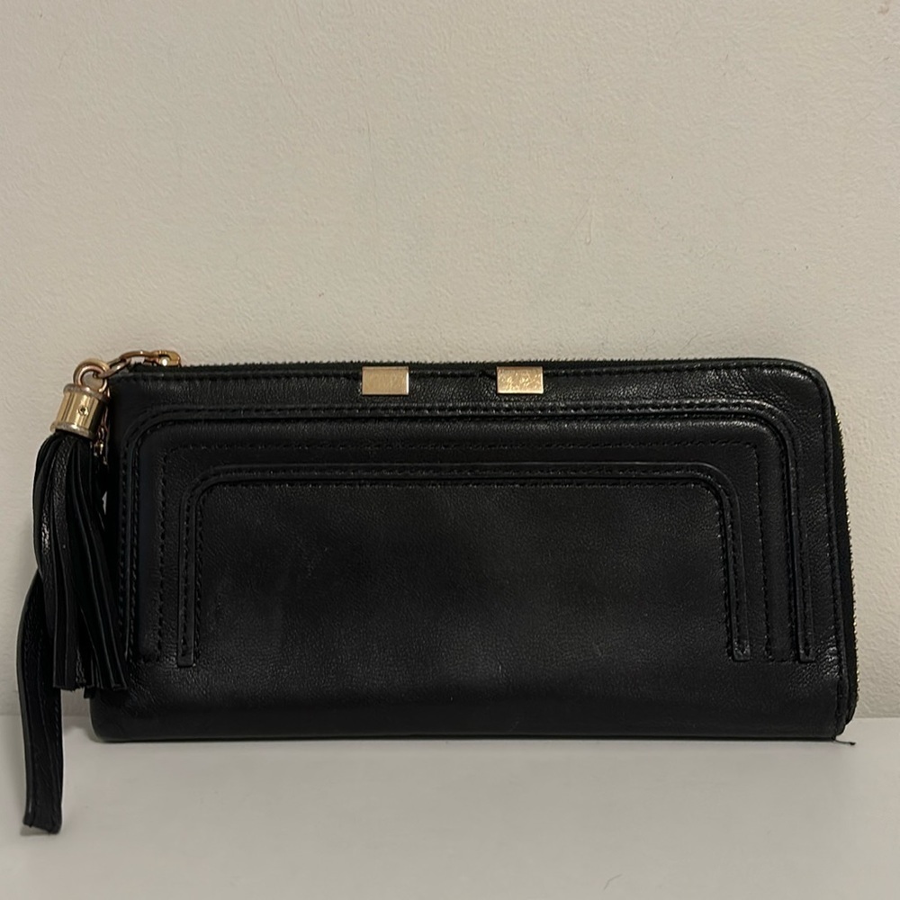 Danier black leather wristlet/wallet with goldtone zipper and tassel